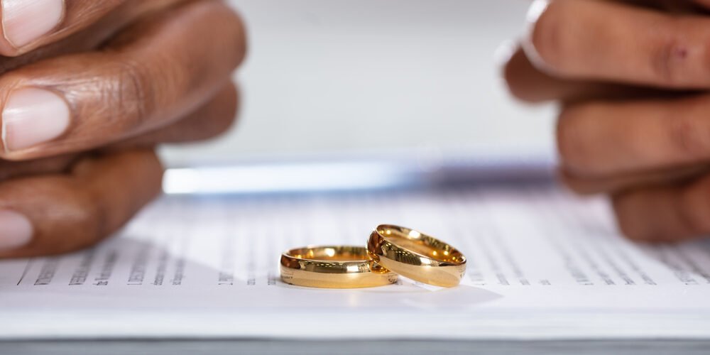 Couple Hands On Divorce Agreement Couple Hands On Divorce Agreement