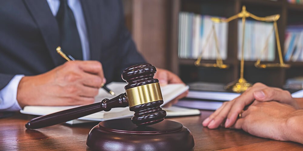 Estate Planning and Divorce- Safeguarding Generational Wealth in New Jersey Lawyer discussing estate planning updates with a client to safeguard generational wealth during divorce.