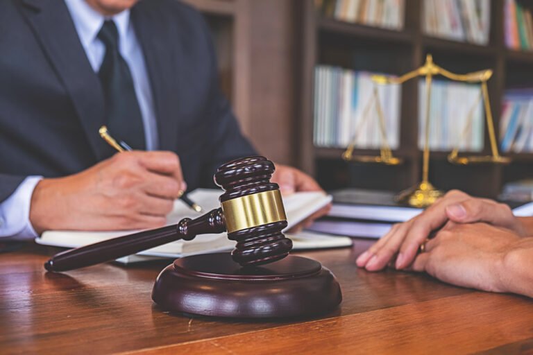 Lawyer discussing estate planning updates with a client to safeguard generational wealth during divorce.