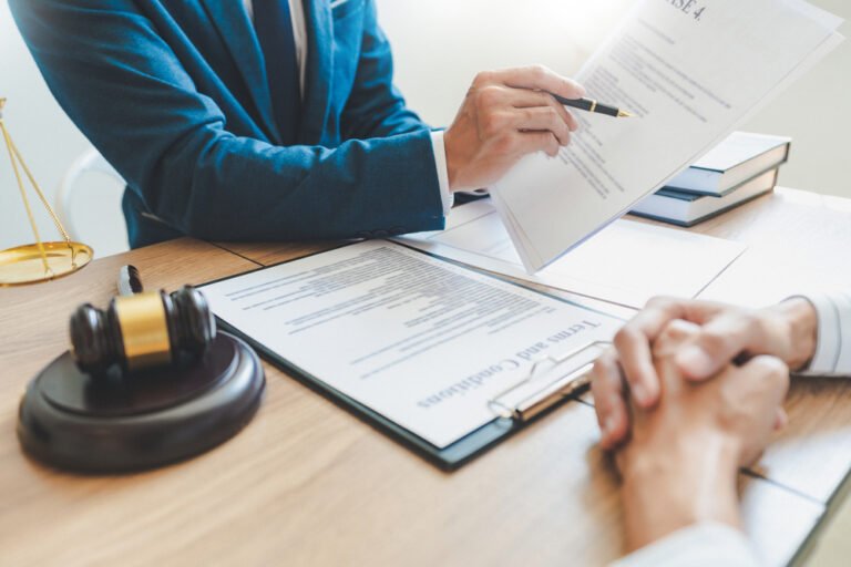 Valuing and Dividing Intellectual Property in High-Asset Divorces Legal expert reviewing valuation documents for intellectual property during a high-asset divorce.