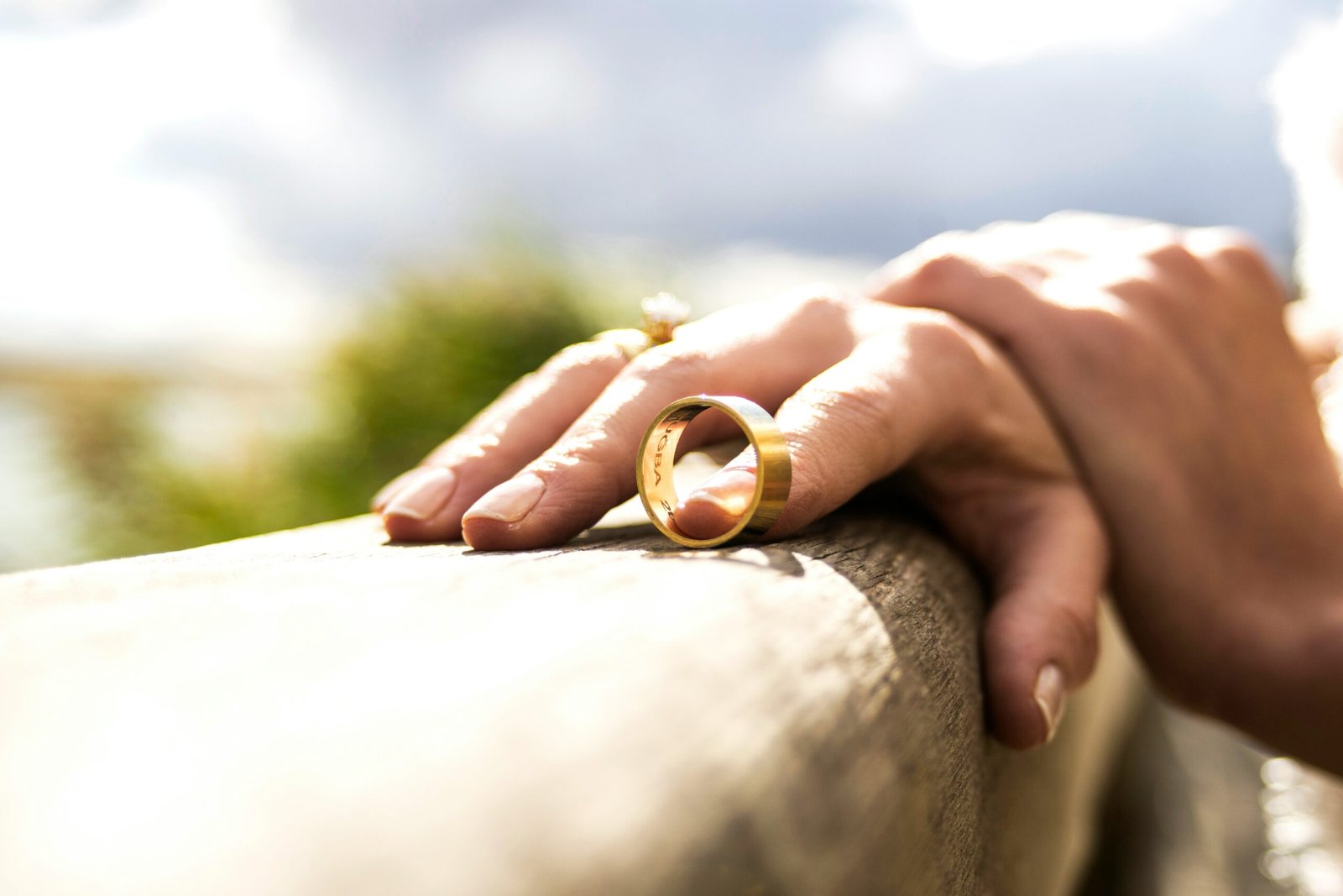 Person taking off their wedding ring.