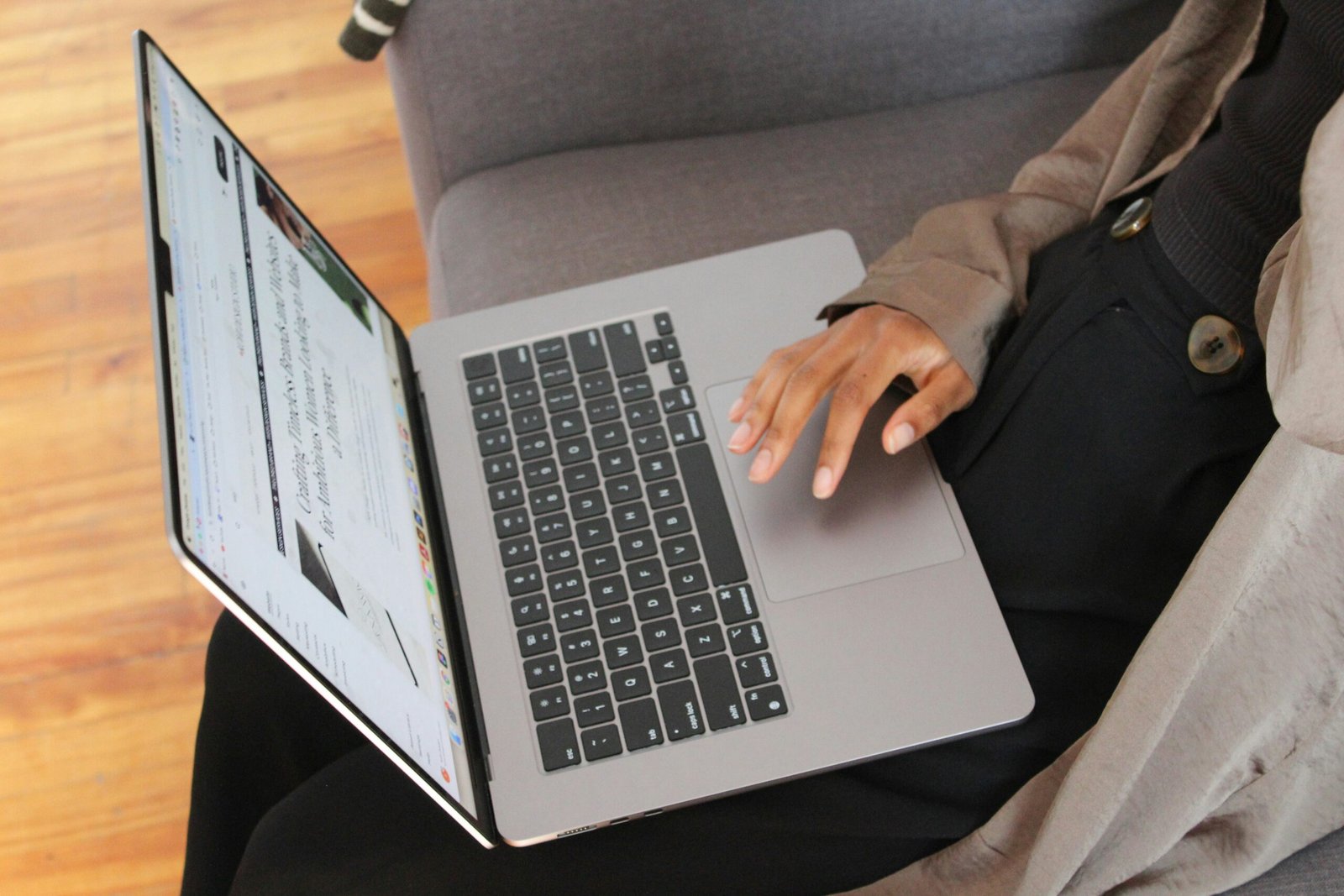 person typing on laptop.